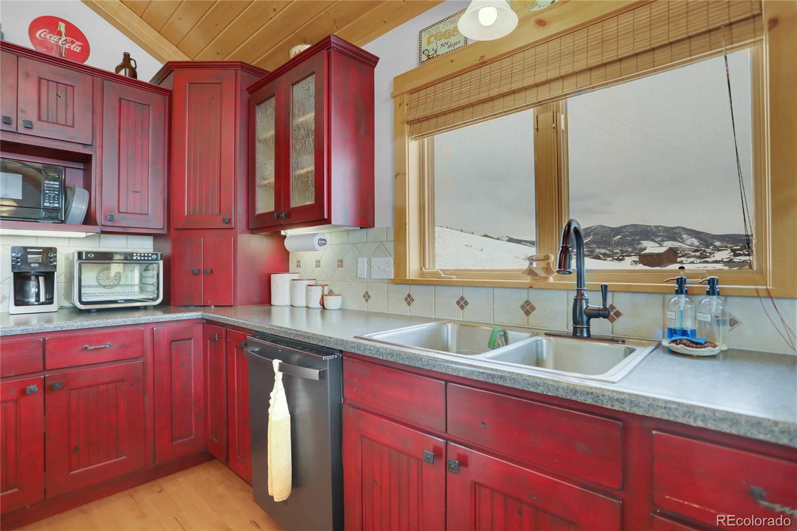 20 County Road 523 Tabernash, CO 80478 - Photo 8 of 32 a kitchen with a sink a window and cabinets