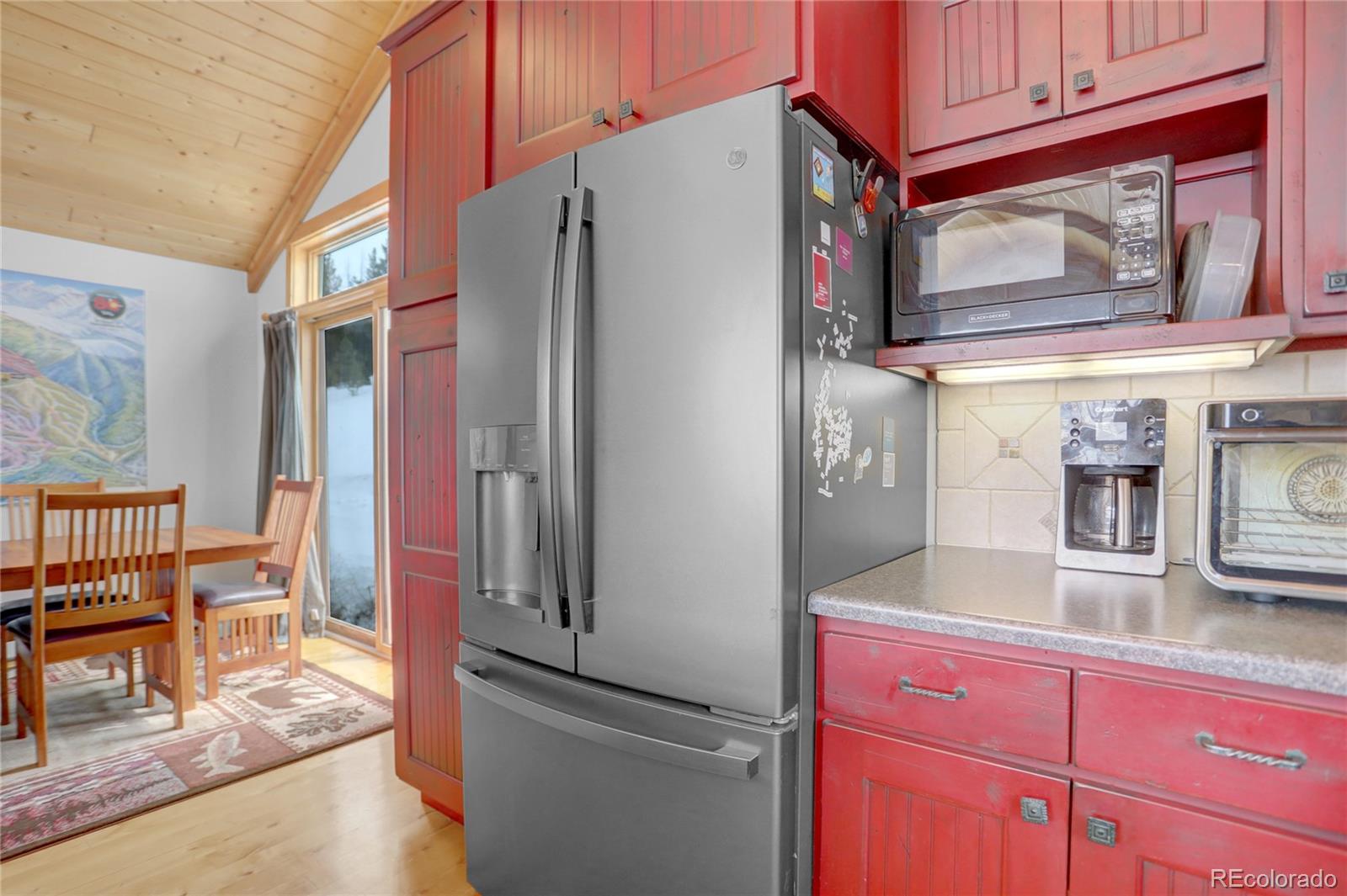 20 County Road 523 Tabernash, CO 80478 - Photo 9 of 32 a kitchen with stainless steel appliances granite countertop a refrigerator and a stove