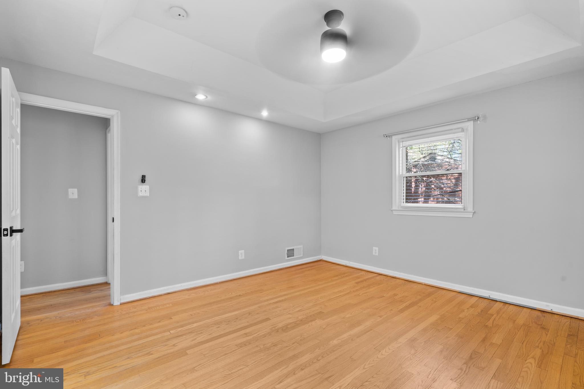 1603 Kirby Road McLean, VA 22101 - Photo 16 of 38 an empty room with wooden floor and windows