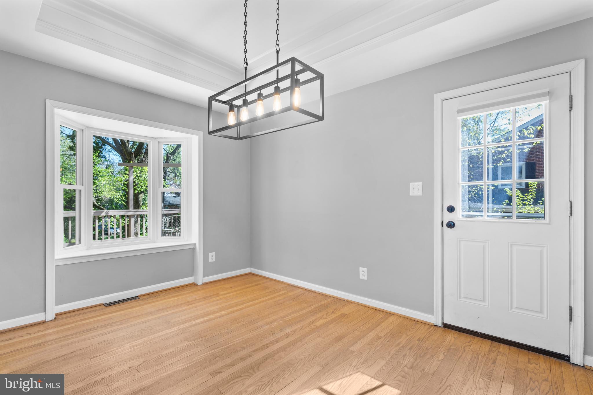1603 Kirby Road McLean, VA 22101 - Photo 9 of 38 a view of empty room with wooden floor and window