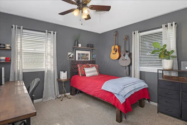 a bedroom with a bed and window