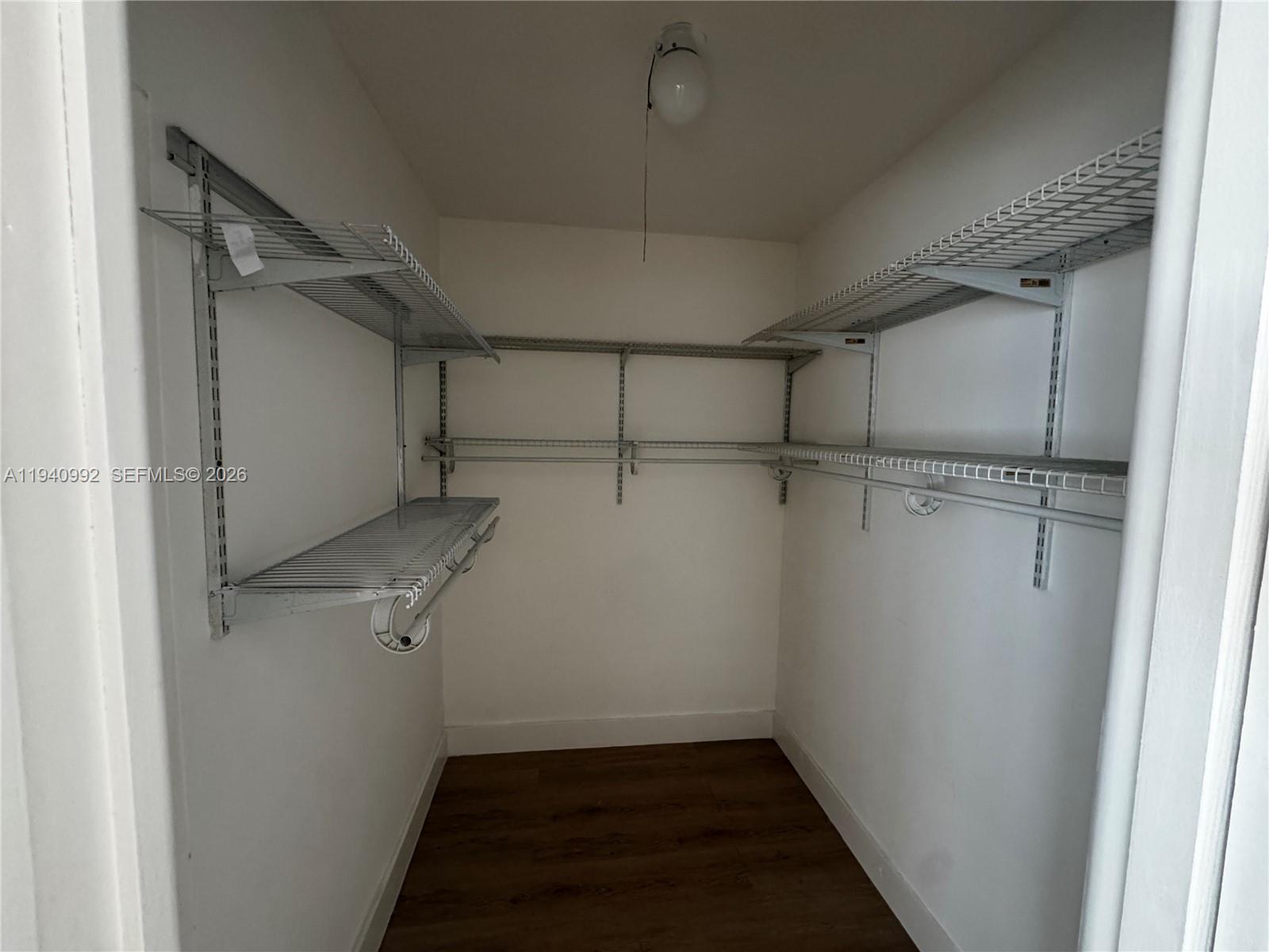 500 13th Street, Unit 10 Miami Beach, FL 33139 - Photo 11 of 12 a view of a room with racks on the wall