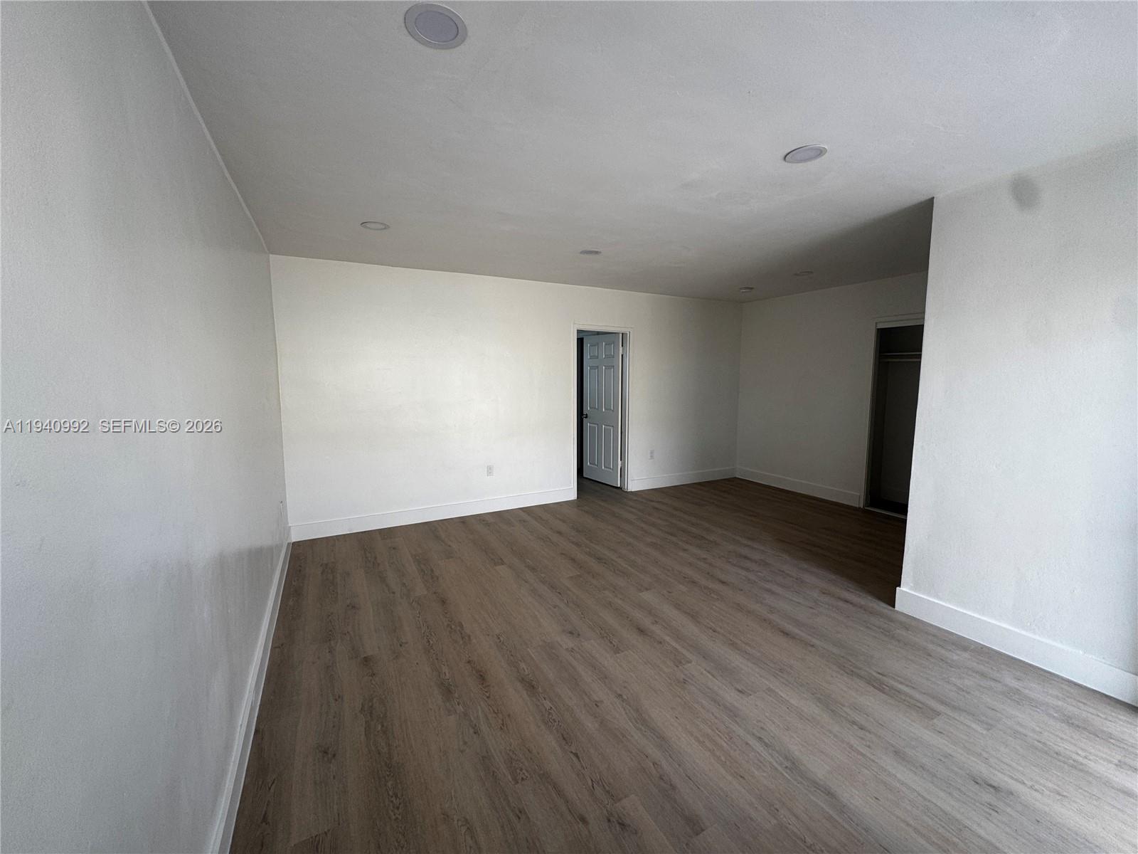500 13th Street, Unit 10 Miami Beach, FL 33139 - Photo 6 of 12 wooden floor in an empty room