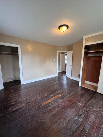 a view of an empty room with wooden walls