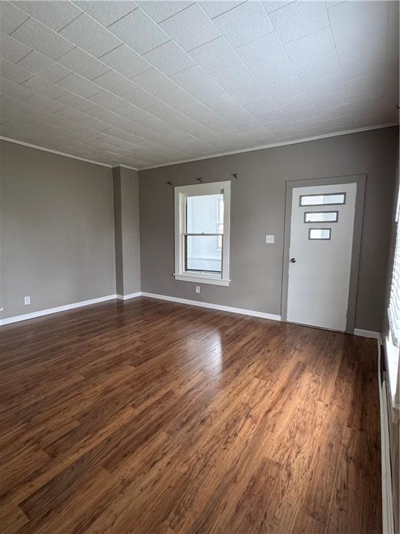 504 Emerson Avenue Farrell, PA 16121 - Photo 9 of 24 an empty room with wooden floor and windows