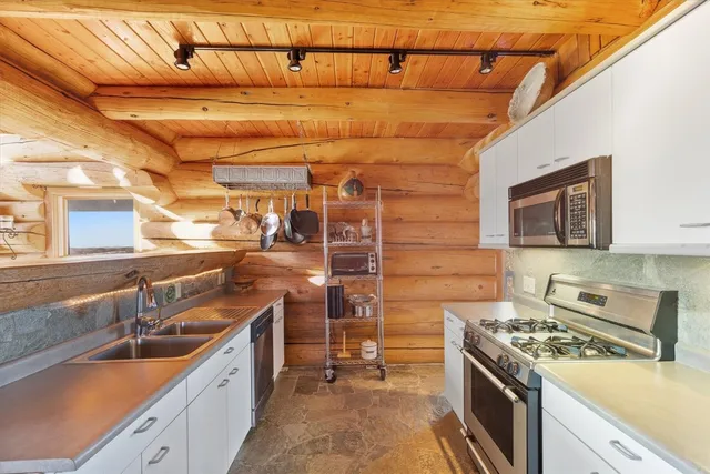 a kitchen with a stove and a sink