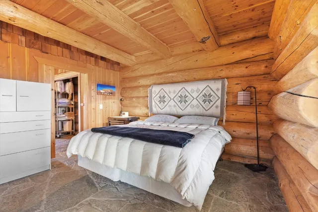 a bedroom with a bed and a cabinets