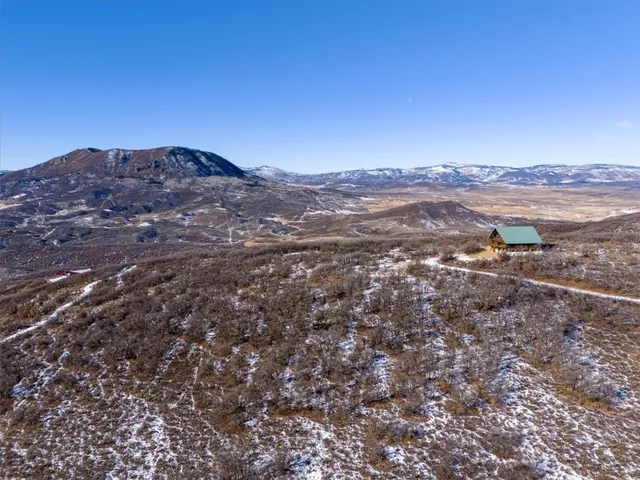 a view of mountains and valleys
