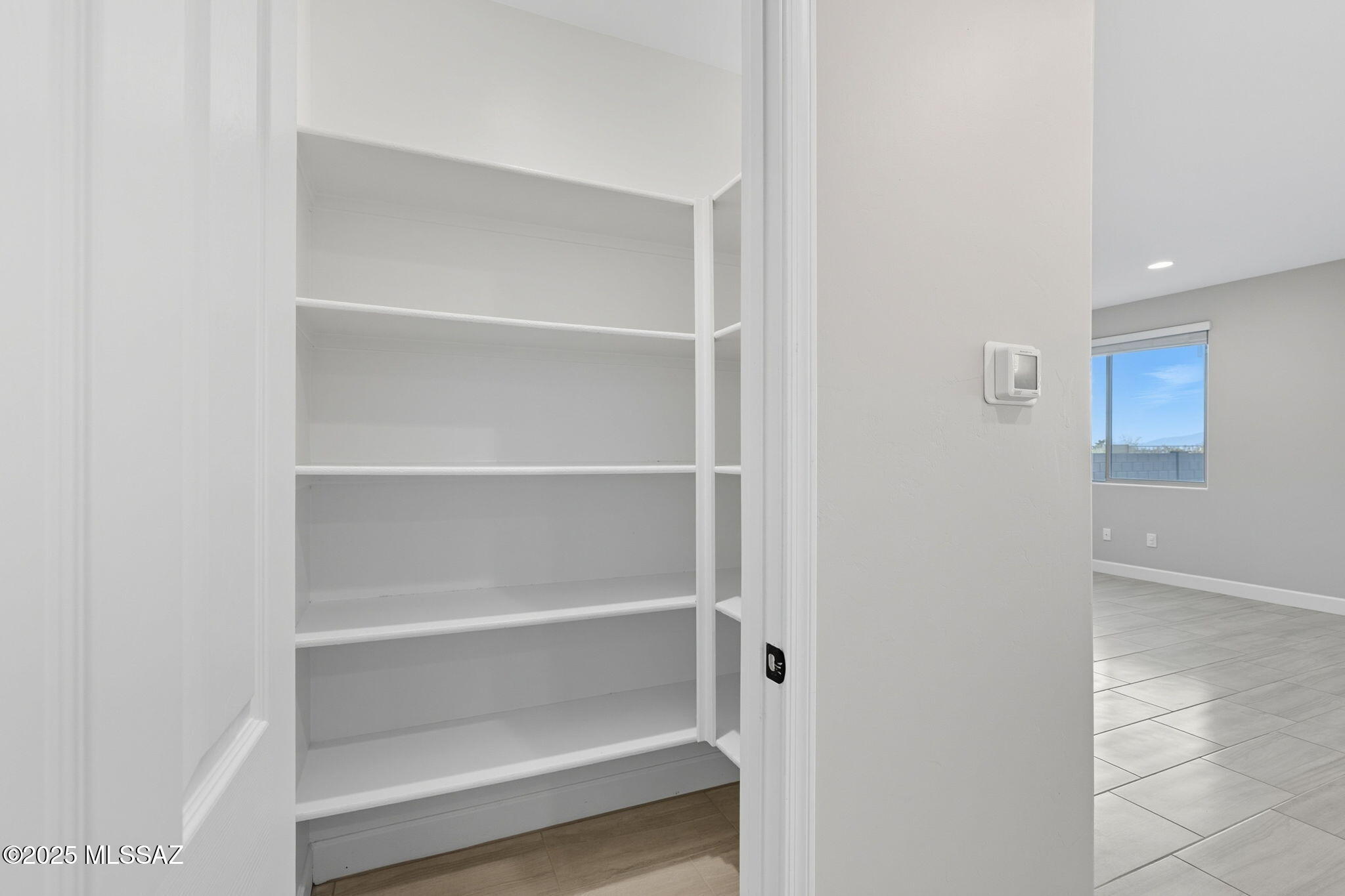12100 East Ryscott Circle Vail, AZ 85641 - Photo 13 of 53 a view of walk in closet with empty racks