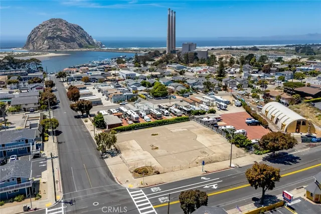 an aerial view of a building with parking space