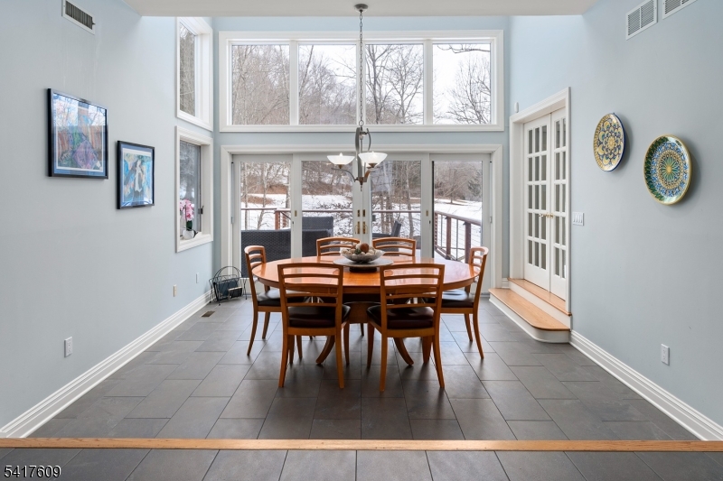 2 Cobblefield Road Mendham, NJ 07945 - Photo 13 of 50 a dining room with furniture a rug and a large window