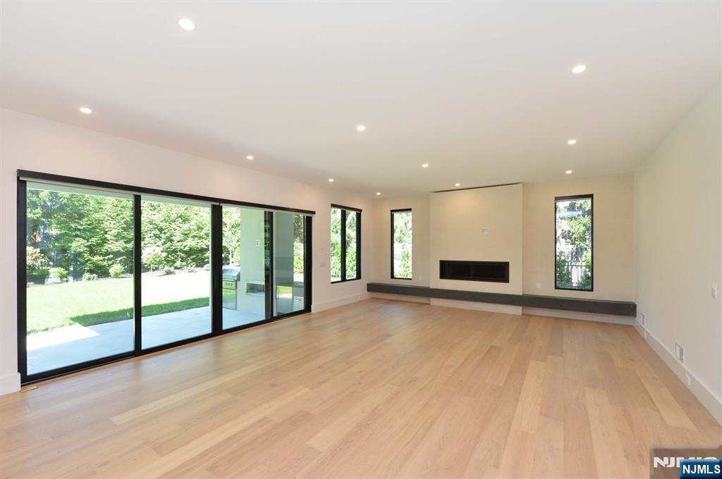 3 Central Avenue Demarest, NJ 07627 - Photo 12 of 49 a view of an empty room with wooden floor and a window
