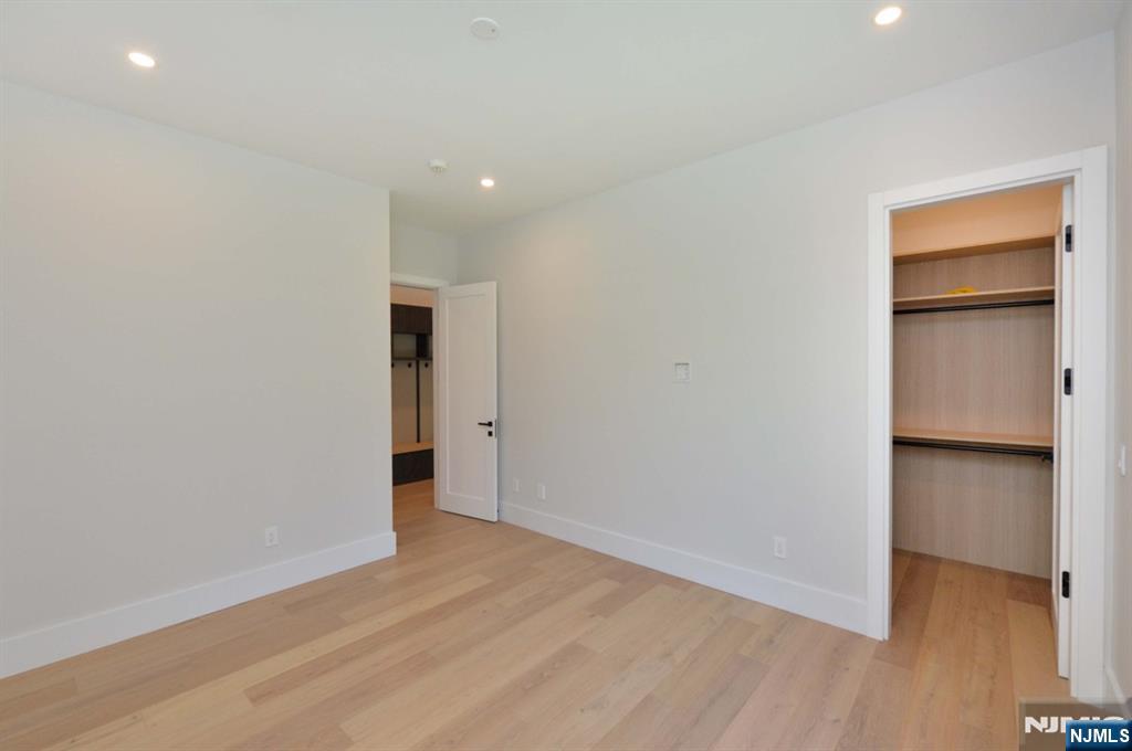3 Central Avenue Demarest, NJ 07627 - Photo 18 of 49 a view of an empty room with closet and wooden floor
