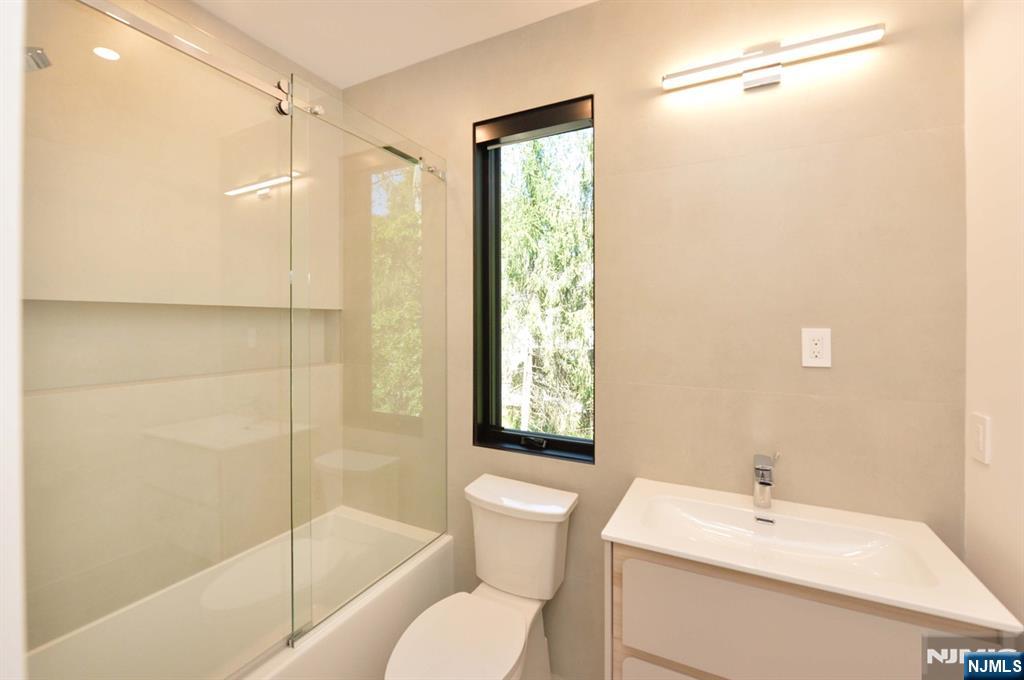 3 Central Avenue Demarest, NJ 07627 - Photo 20 of 49 a bathroom with a sink toilet and shower