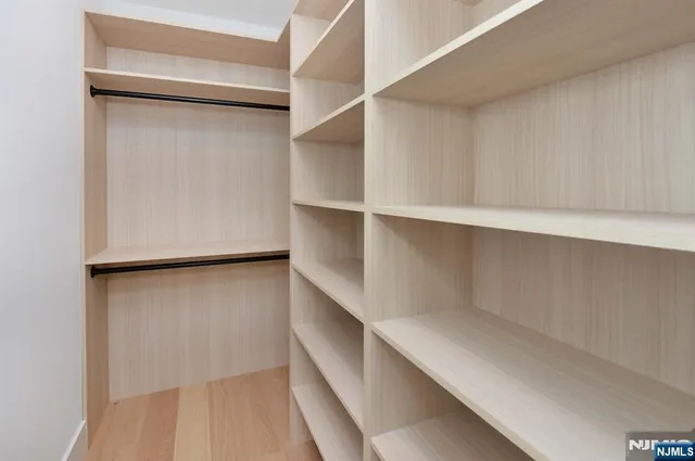 a view of an empty walk in closet