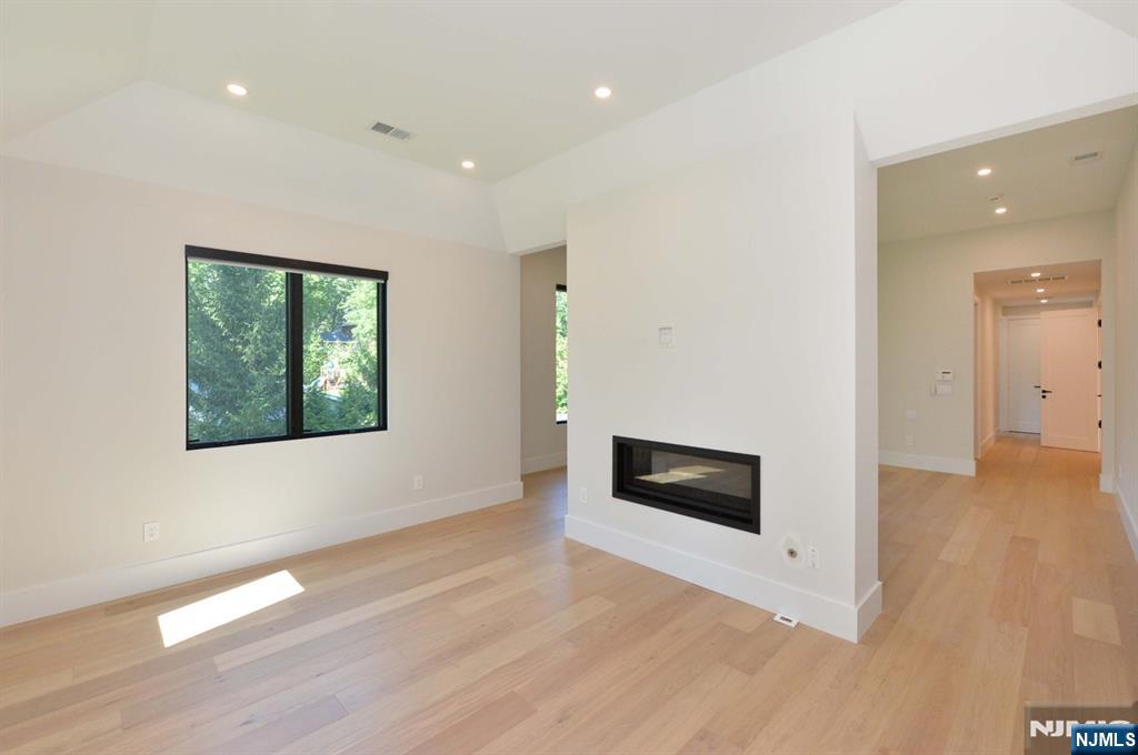 3 Central Avenue Demarest, NJ 07627 - Photo 29 of 49 a view of an empty room with a window and wooden floor