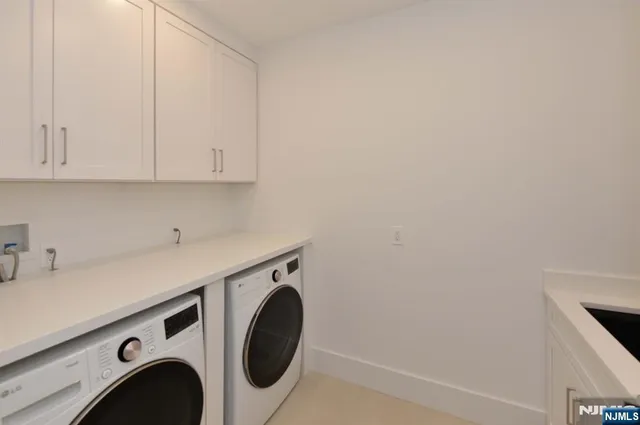 a white toilet sitting next to a bathroom sink