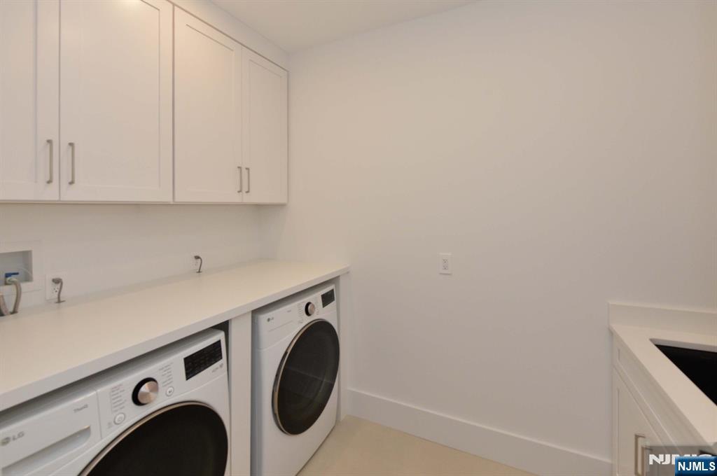 3 Central Avenue Demarest, NJ 07627 - Photo 32 of 49 a utility room with dryer and washer