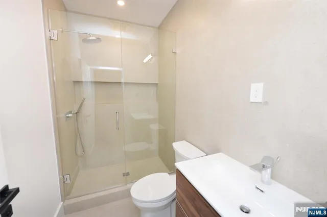a kitchen with stainless steel appliances a sink and cabinets