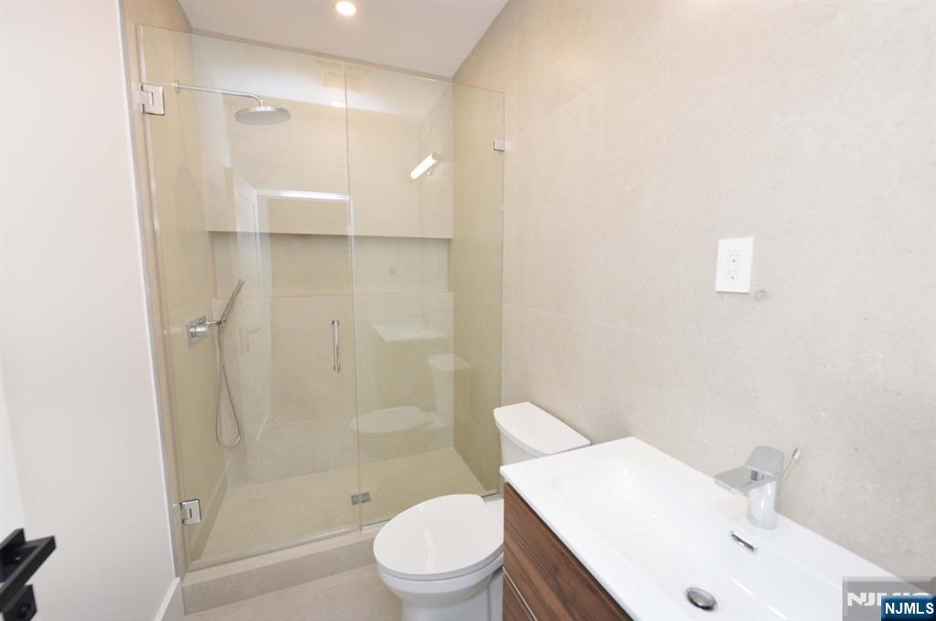 3 Central Avenue Demarest, NJ 07627 - Photo 41 of 49 a bathroom with a sink a toilet and shower
