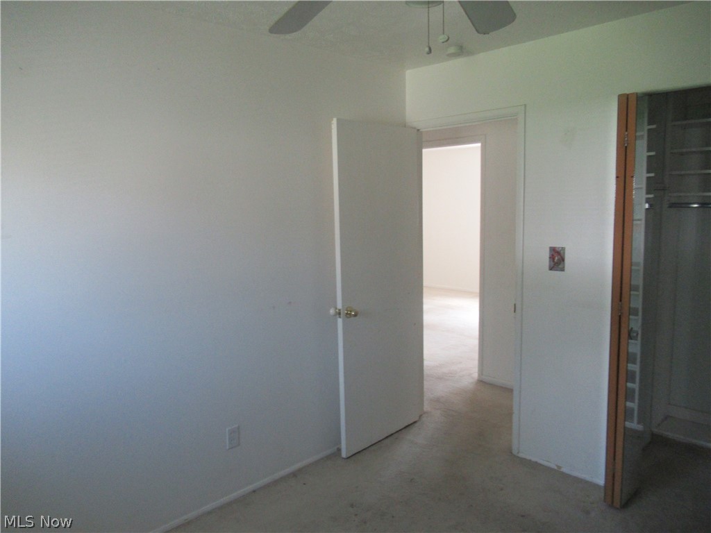 6033 Randy Road Bedford Heights, OH 44146 - Photo 15 of 19 Interior room featuring a ceiling fan, white painted walls, and baseboard trim