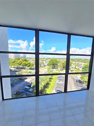 a bathroom with a granite countertop sink toilet and a mirror