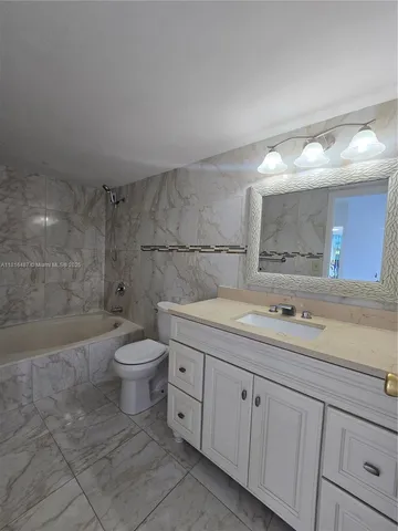 a kitchen with a stove and a microwave