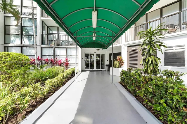 a view of a house with a flower garden