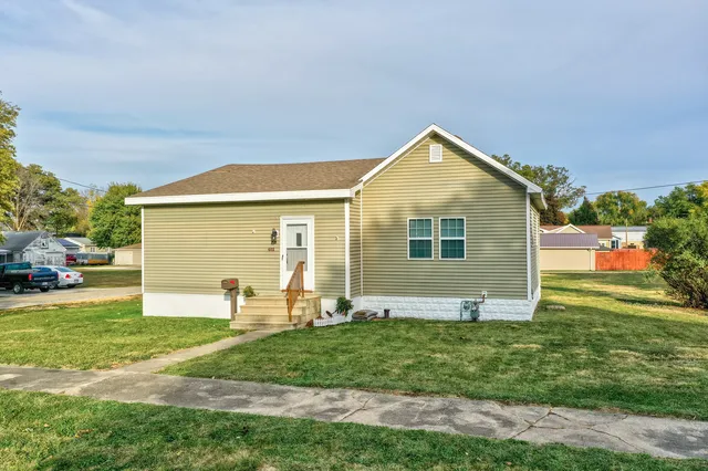 a front view of a house with garden
