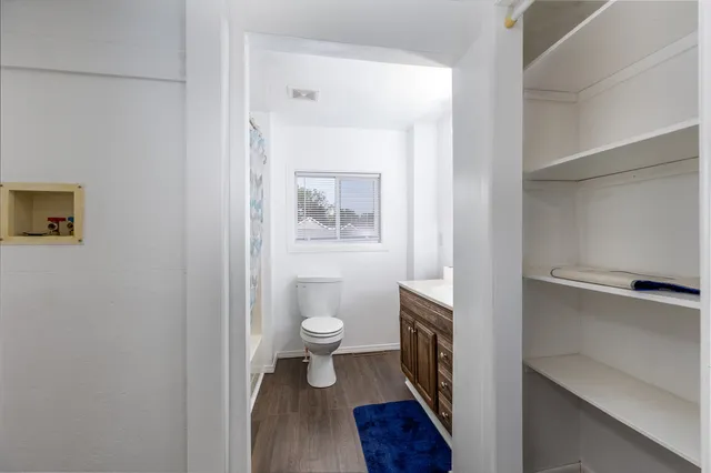 a bathroom with a toilet and a sink