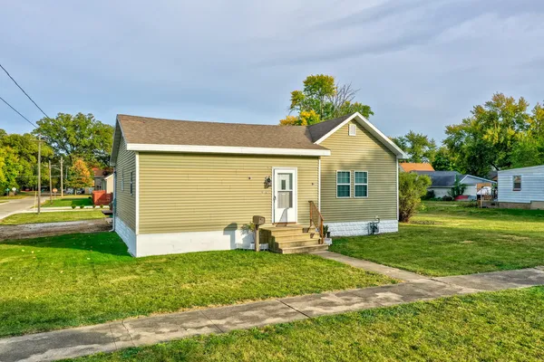 a front view of a house with garden