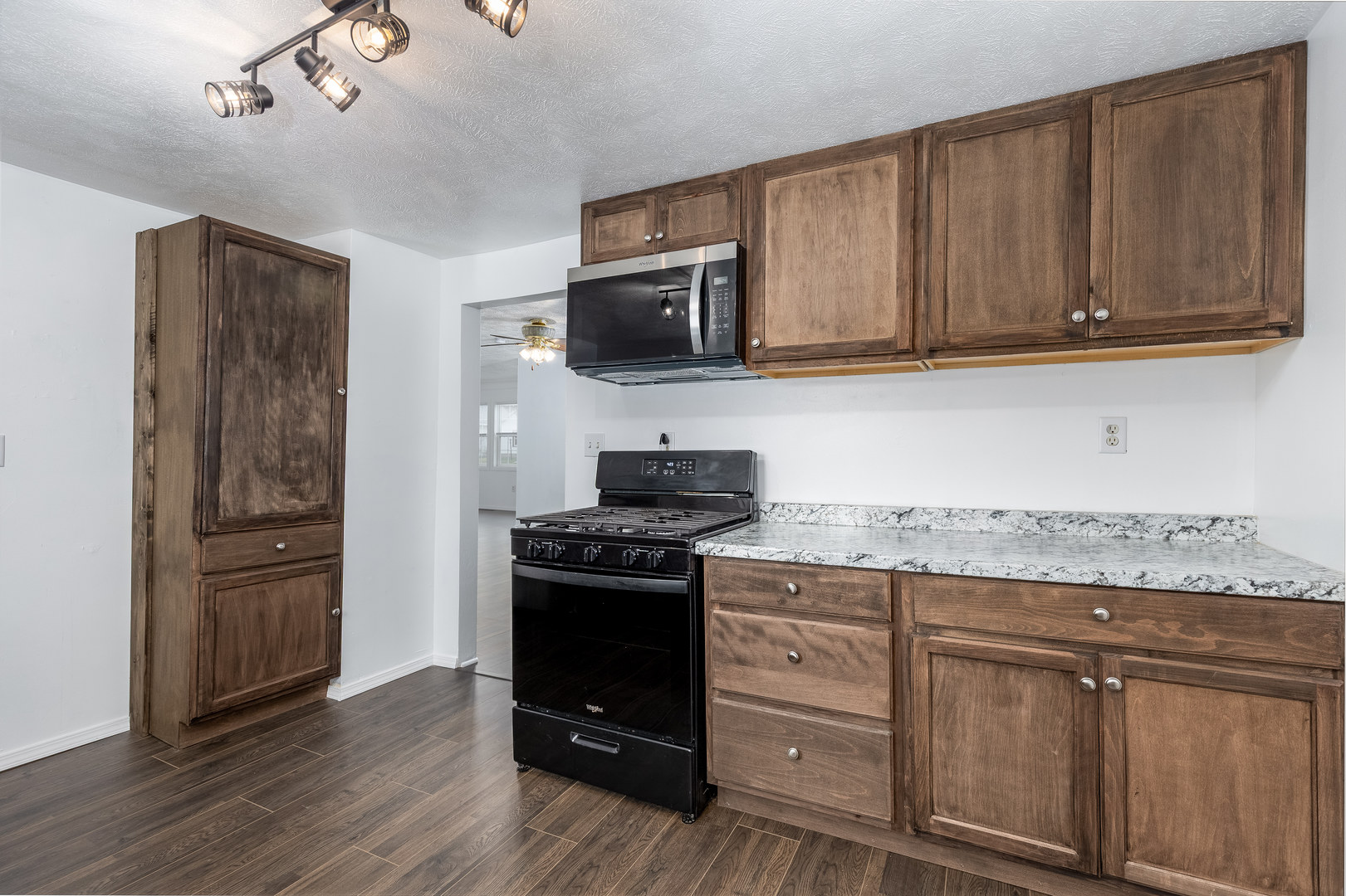 401 South 5th Avenue Streator, IL 61364 - Photo 9 of 17 a kitchen with stainless steel appliances granite countertop a stove and a refrigerator
