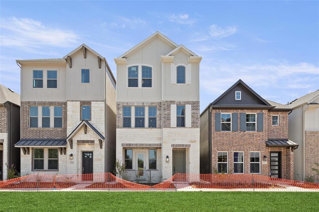 a front view of a house with a yard and porch