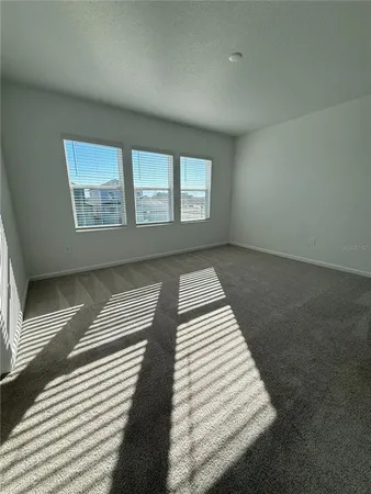 an empty room with wooden floor