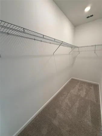 a view of a room with racks on the wall
