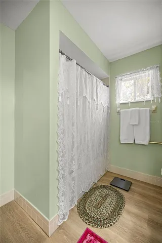 a view of a room with window and gate