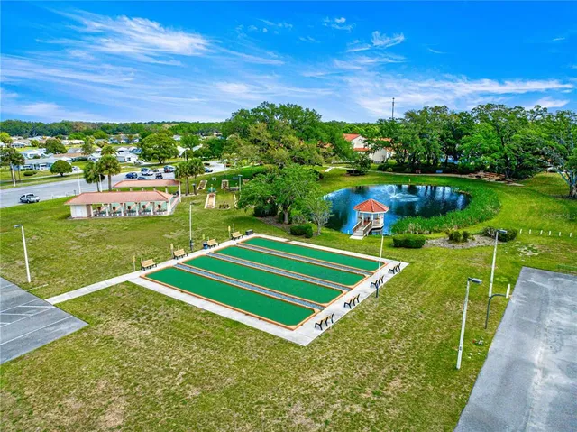 a view of a backyard with plants and a garden