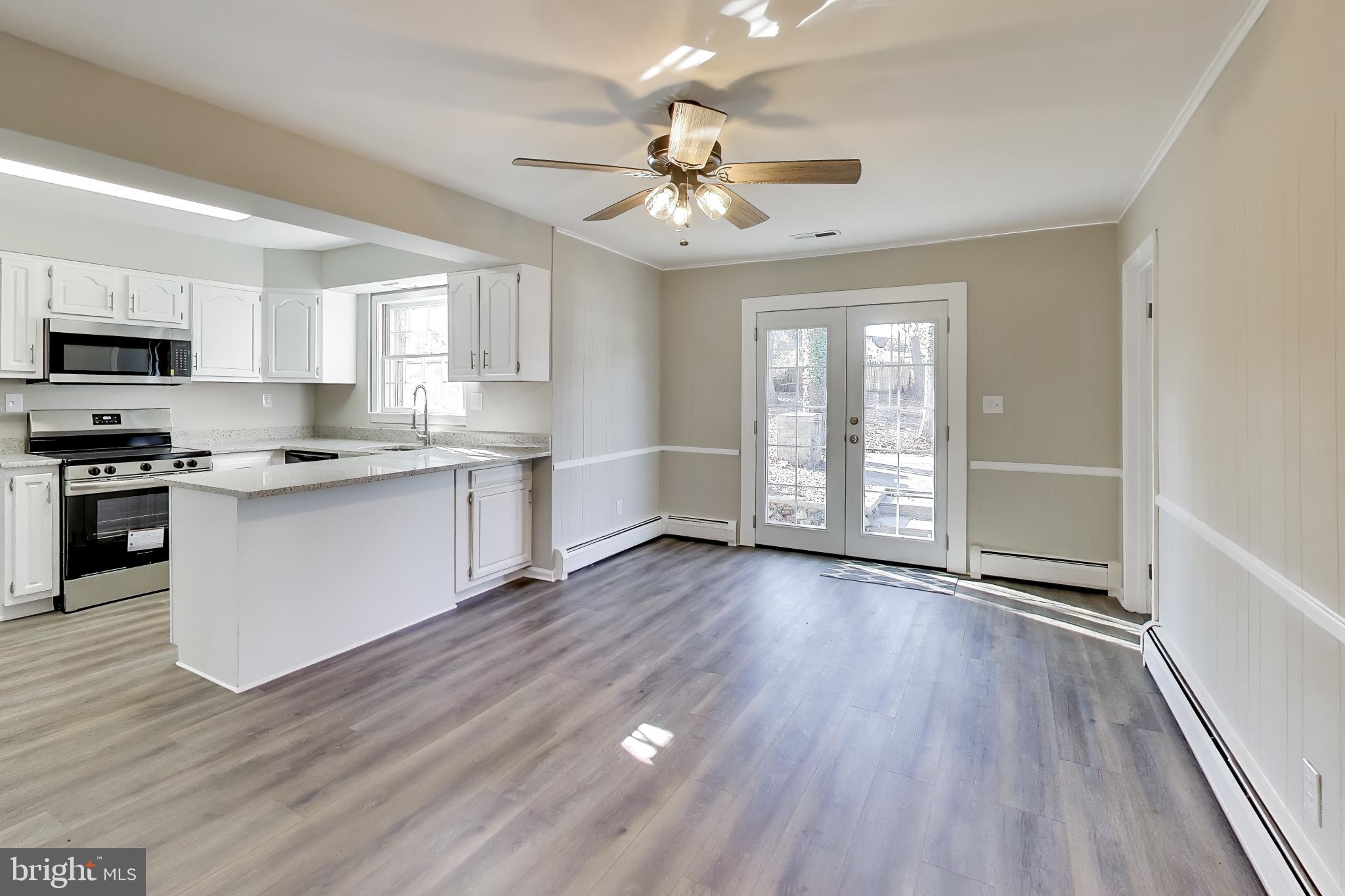 4007 Harrison Road Beltsville, MD 20705 - Photo 14 of 49 a view of kitchen with sink and wooden floor