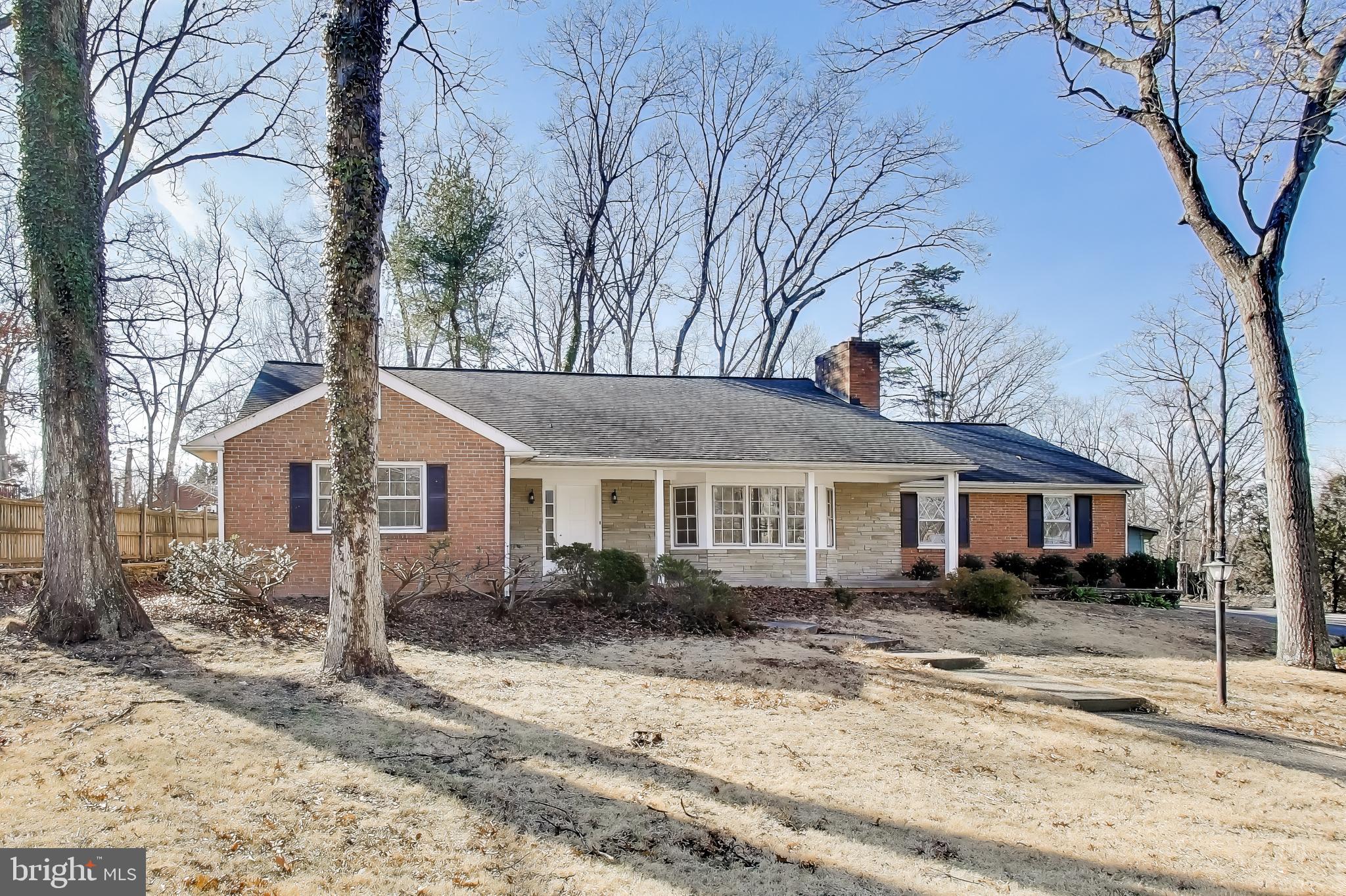 4007 Harrison Road Beltsville, MD 20705 - Photo 2 of 49 a front view of a house with a yard covered in snow