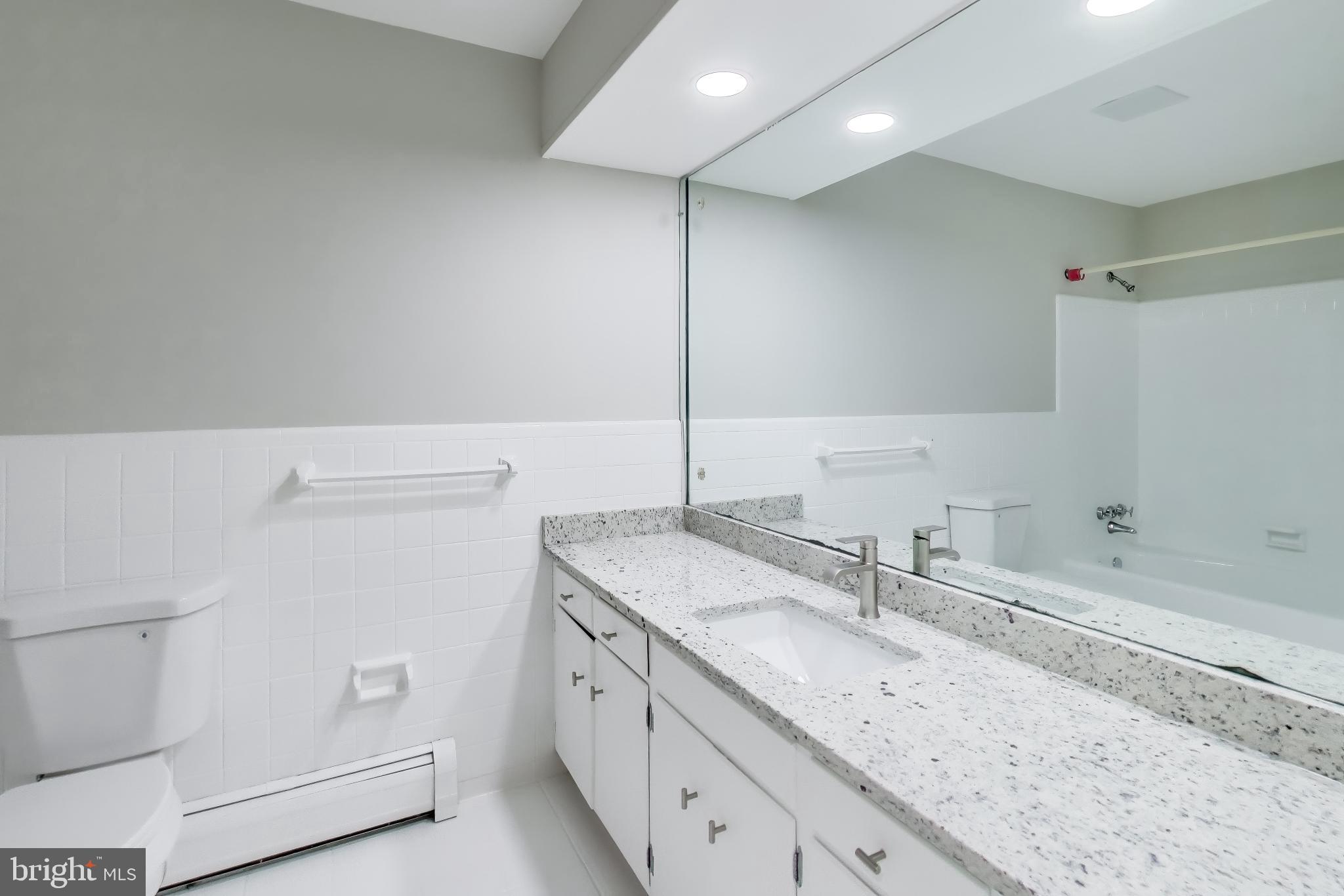 4007 Harrison Road Beltsville, MD 20705 - Photo 26 of 49 a bathroom with a sink and a vanity