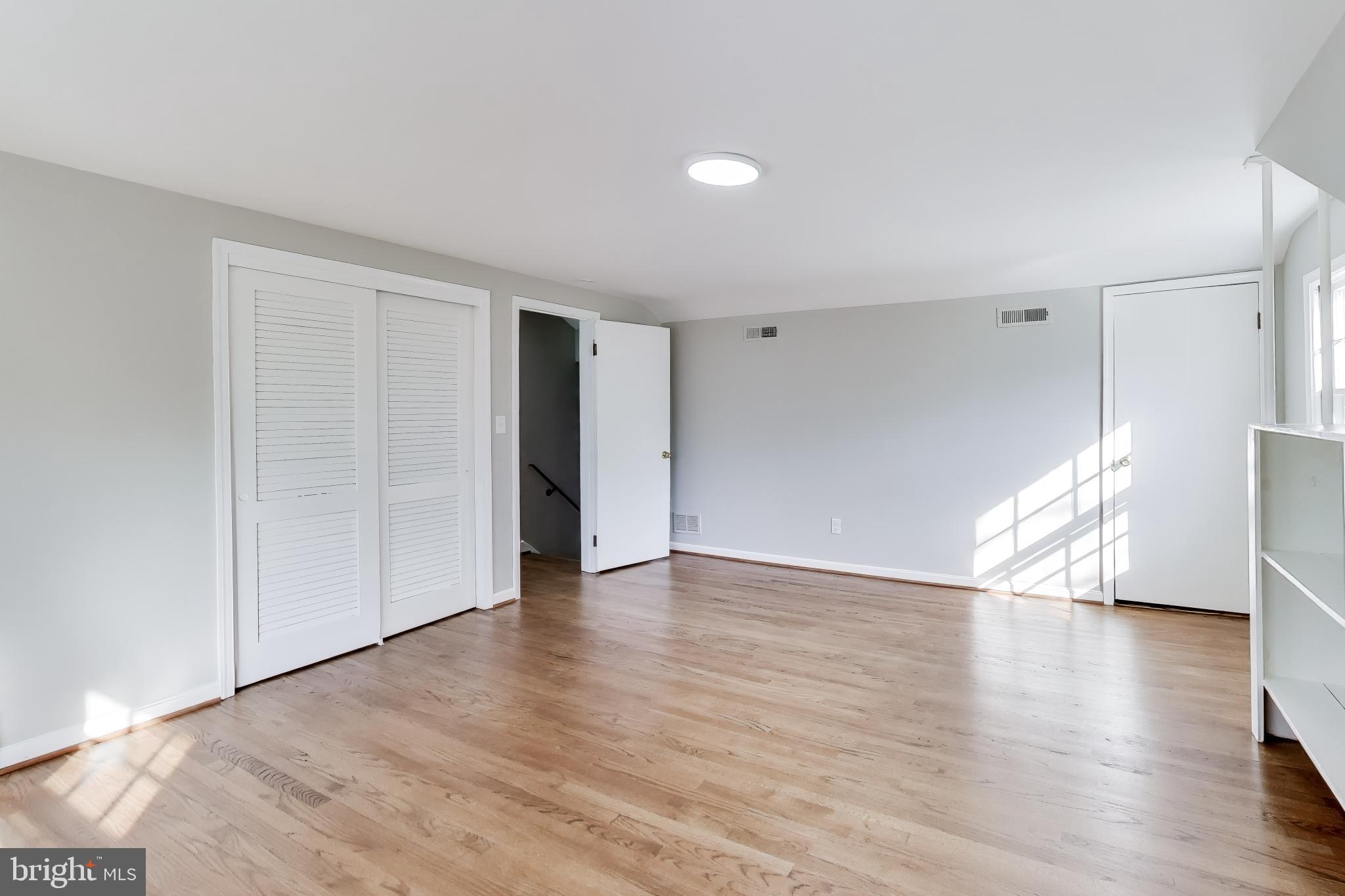 4007 Harrison Road Beltsville, MD 20705 - Photo 29 of 49 a view of an empty room with wooden floor