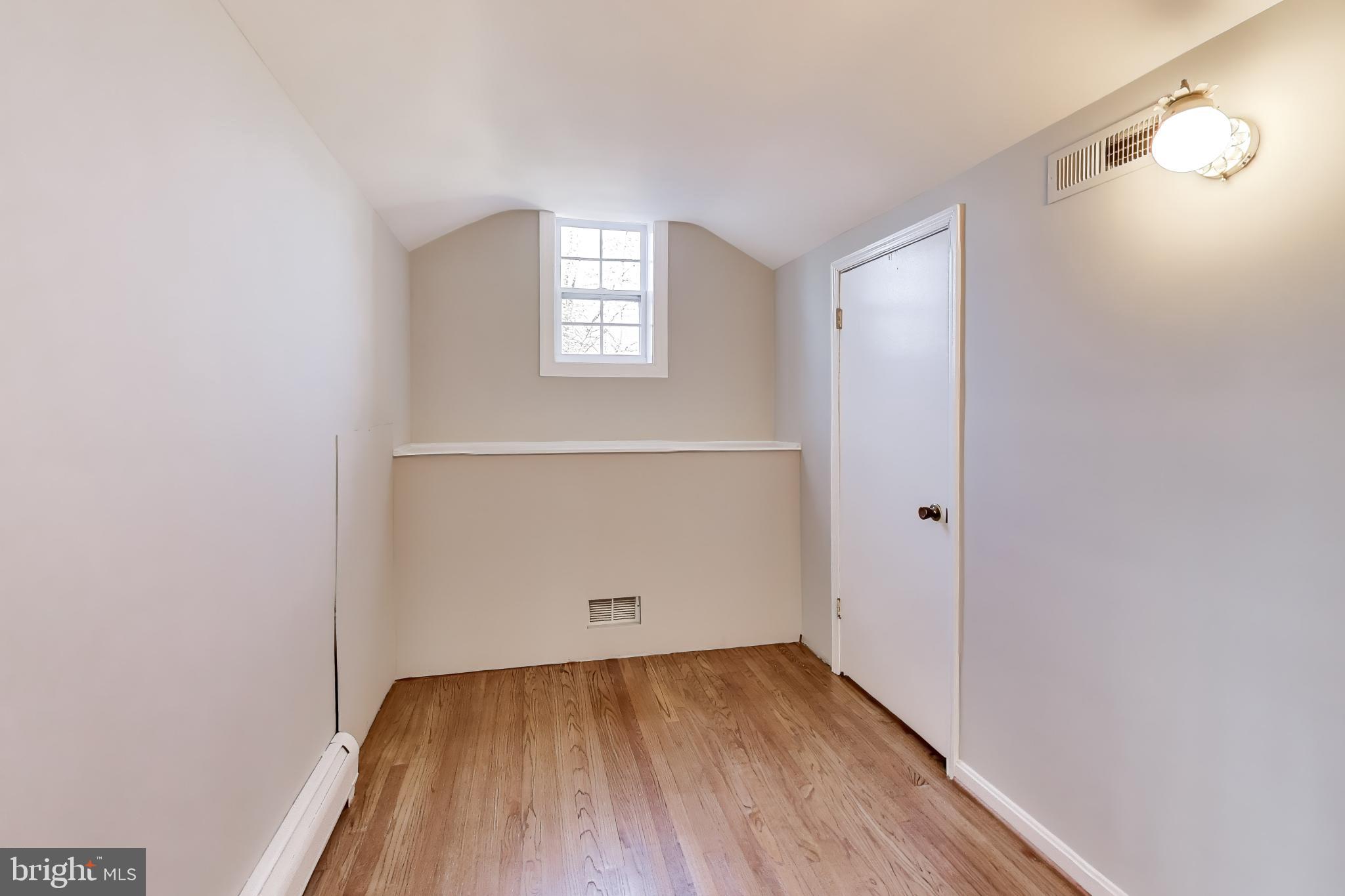 4007 Harrison Road Beltsville, MD 20705 - Photo 32 of 49 an empty room with wooden floor and windows
