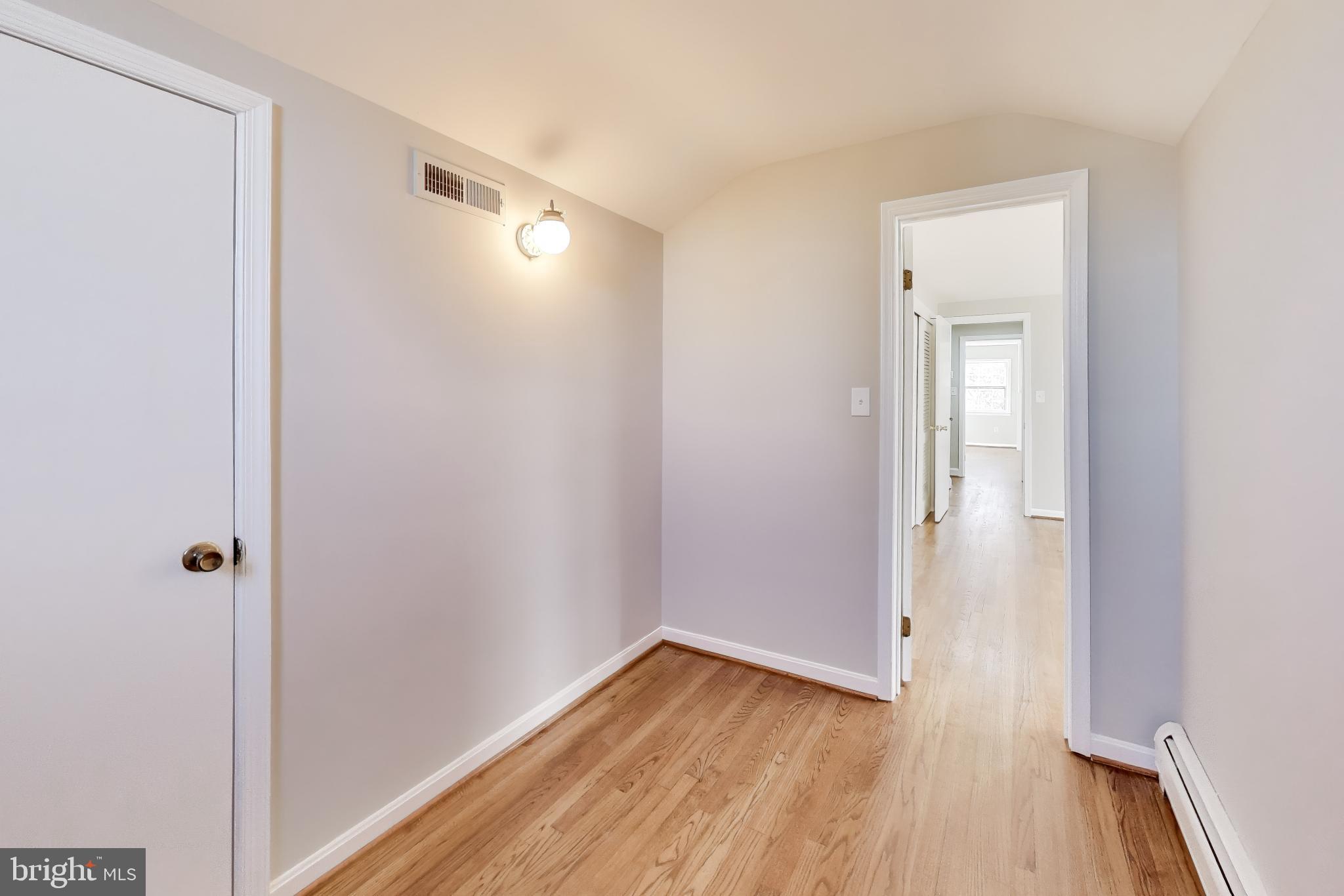 4007 Harrison Road Beltsville, MD 20705 - Photo 33 of 49 a view of a hallway with wooden floor