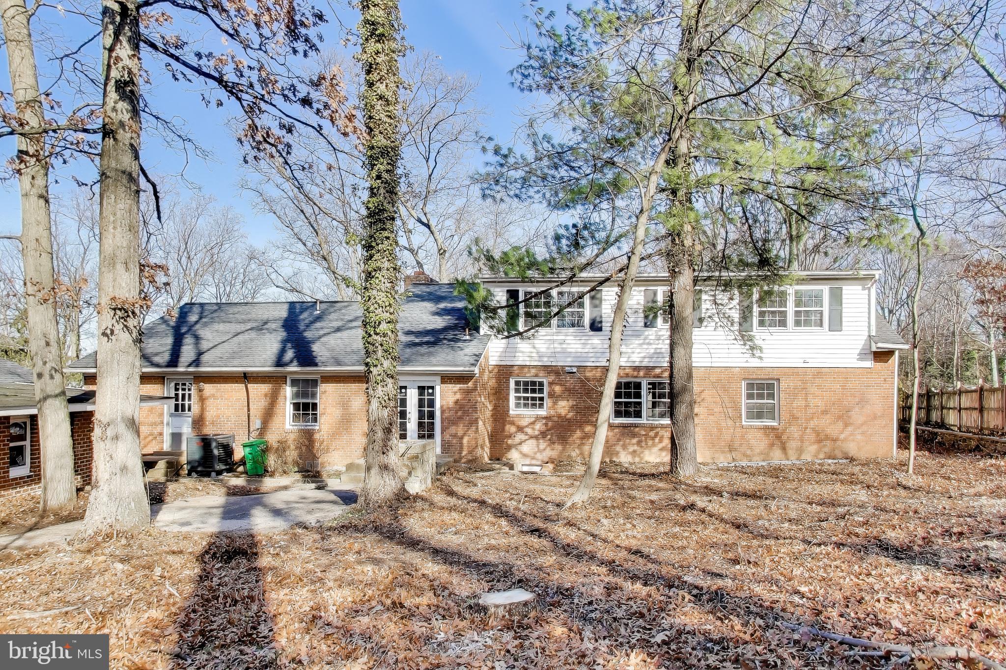 4007 Harrison Road Beltsville, MD 20705 - Photo 36 of 49 a view of a large building with a large tree