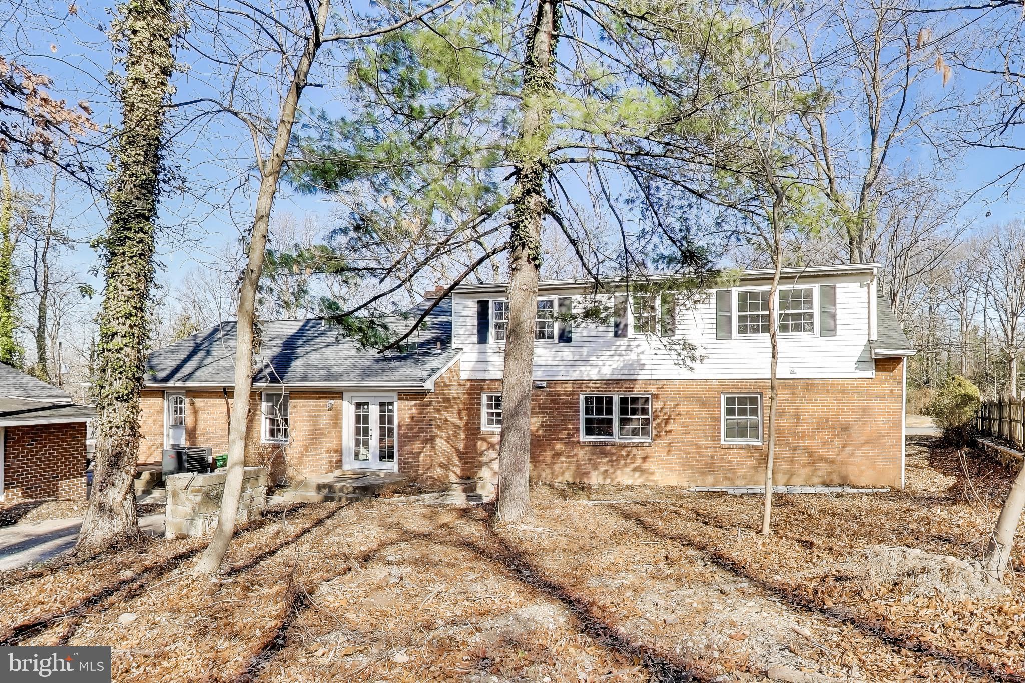 4007 Harrison Road Beltsville, MD 20705 - Photo 37 of 49 a view of a white house with a large tree