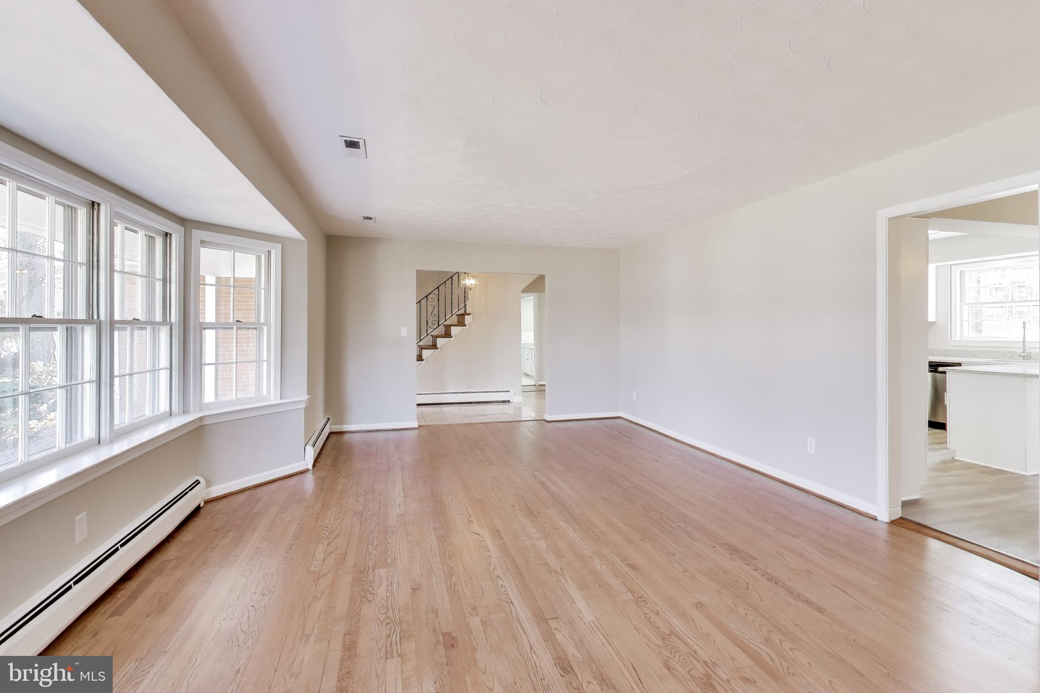 4007 Harrison Road Beltsville, MD 20705 - Photo 8 of 49 wooden floor in an empty room with a window