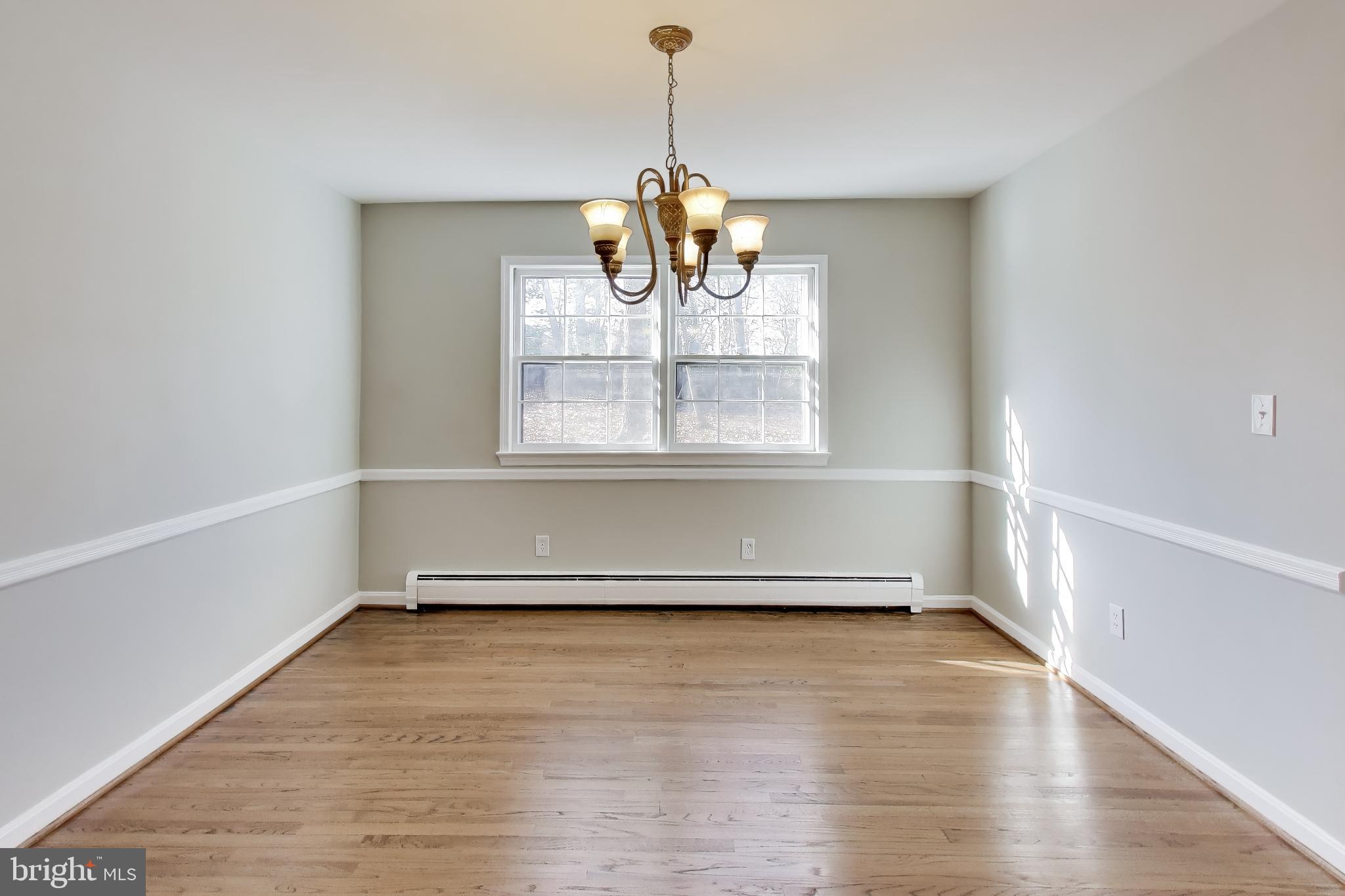 4007 Harrison Road Beltsville, MD 20705 - Photo 9 of 49 a view of empty room with wooden floor and fan