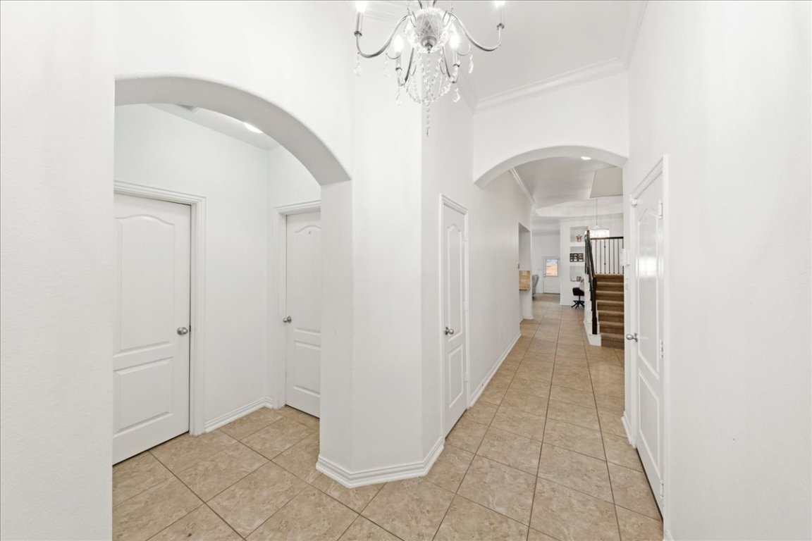 349 Razzmatazz Trail Buda, TX 78610 - Photo 13 of 40 a view of a hallway view with staircase