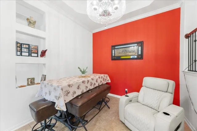 a bedroom with a bed and chair