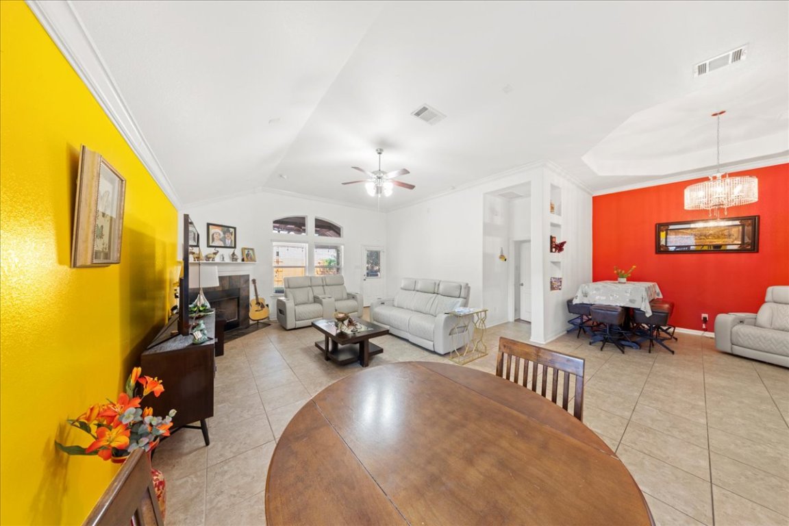 349 Razzmatazz Trail Buda, TX 78610 - Photo 19 of 40 a living room with furniture and a chandelier